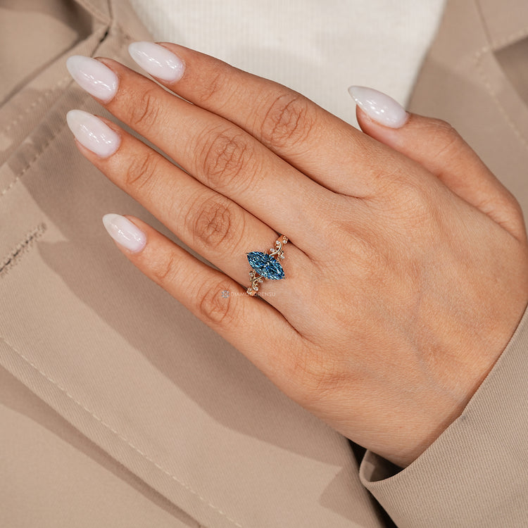 Marquise diamond ring with tulip setting and side stones