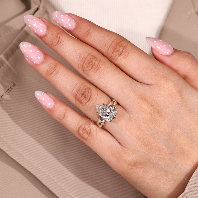 Handmade pear cut ring with nature inspired leaf design.