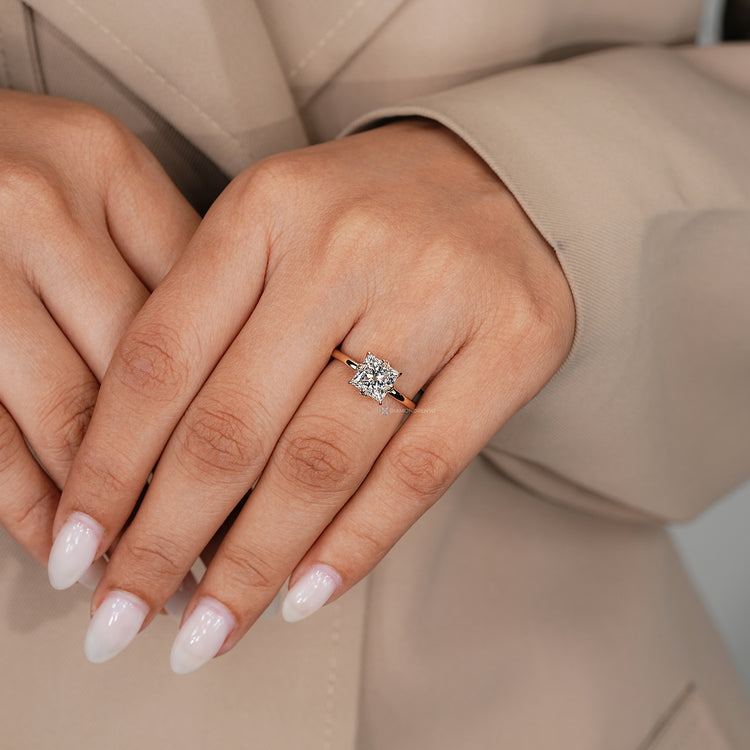 Lab grown diamond solitaire ring with four claw prongs.