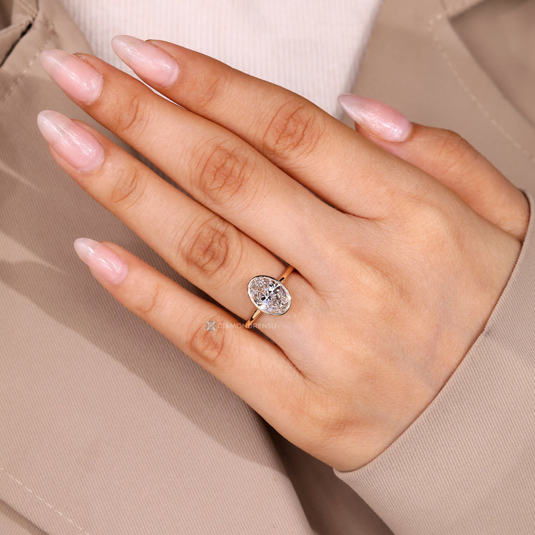 Lab grown oval diamond ring with solitaire style.