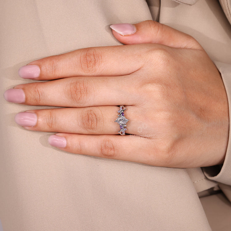 Handmade nature ring with tanzanite and diamond detail.