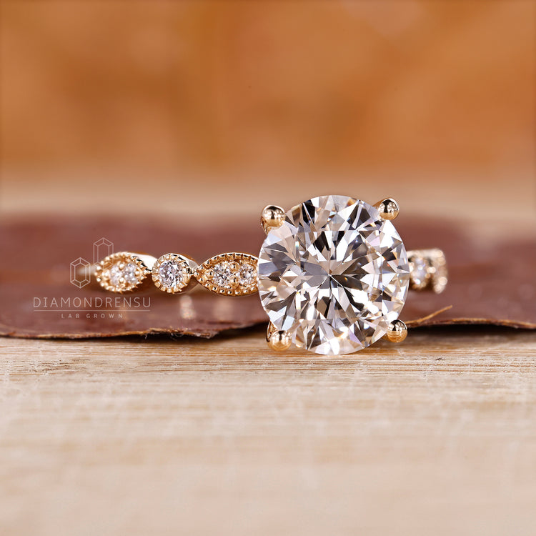 Designer engagement ring with round diamond center.
