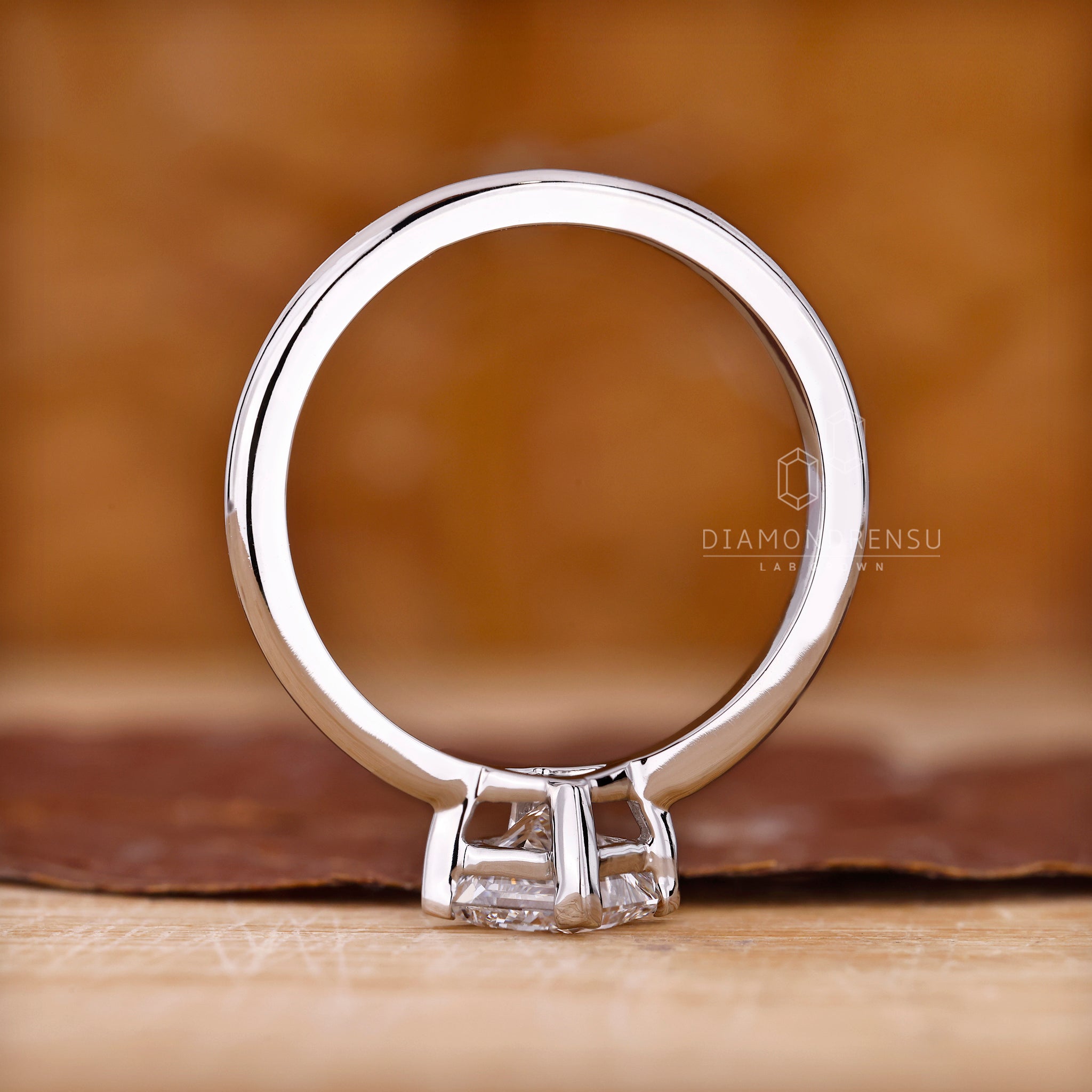 Solitaire diamond ring with tapered shank.