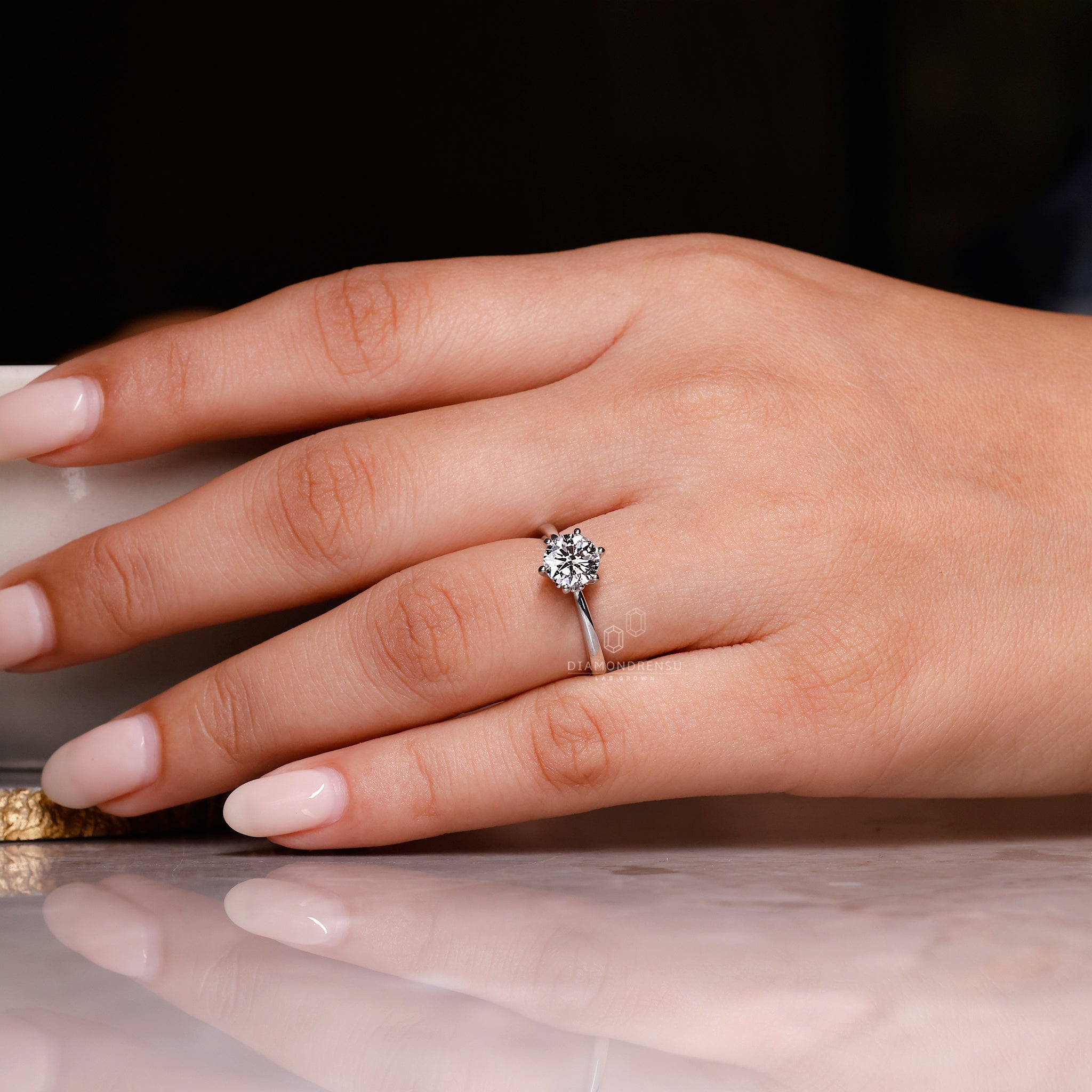 Simple engagement ring with six prong setting