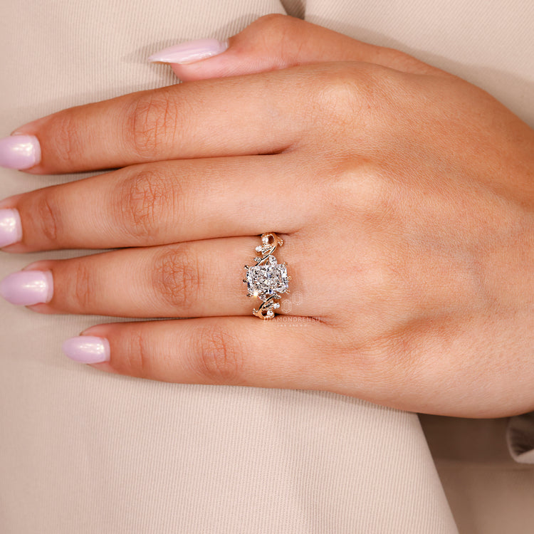 Yellow gold engagement ring with marquise and round accents