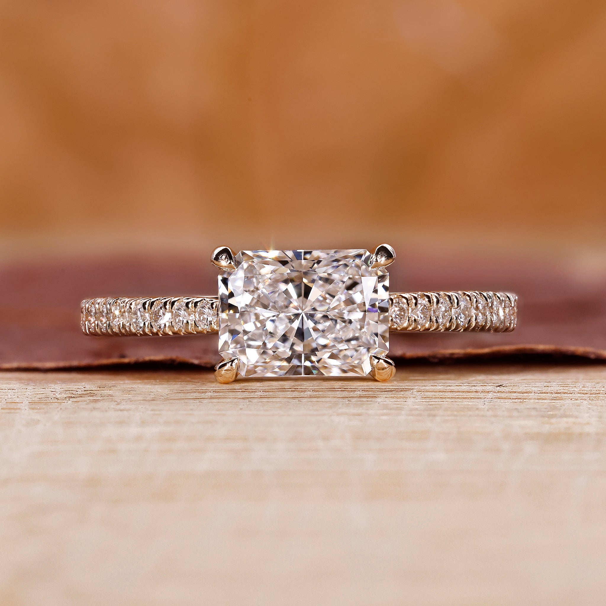 Radiant cut diamond engagement ring in yellow gold
