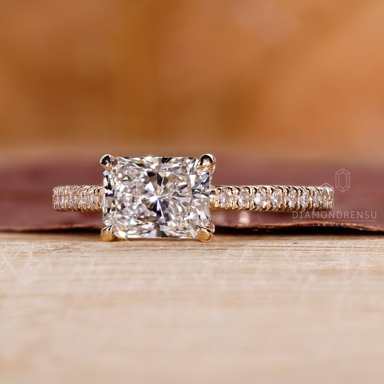 Unique east west engagement ring design
