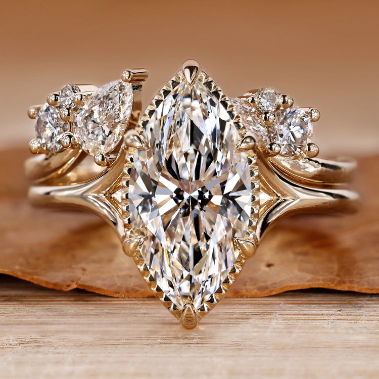 Bridal set with marquise centre diamond and solitaire style.