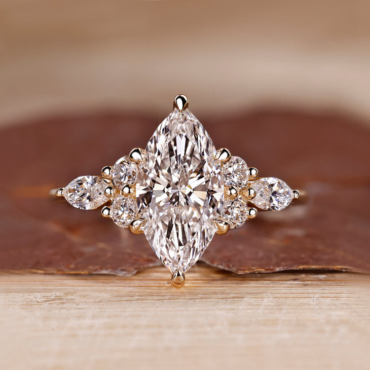 Marquise cut lab grown diamond ring with side stones.