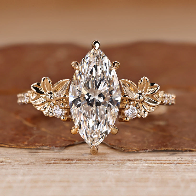 Marquise cut diamond ring with nature inspired flower design.