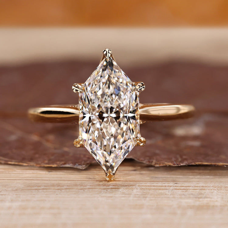 Marquise cut diamond ring with hidden halo and tapered band.