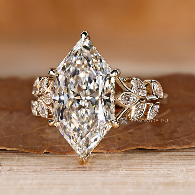 Marquise and round diamond ring with cluster setting.