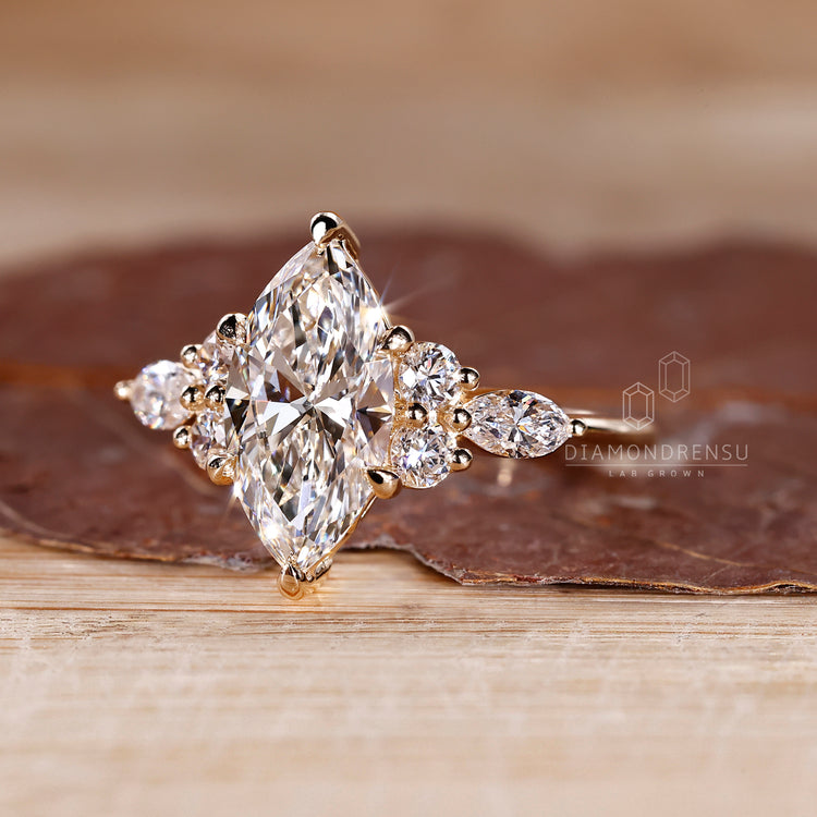Marquise diamond ring with muse setting and side stones.