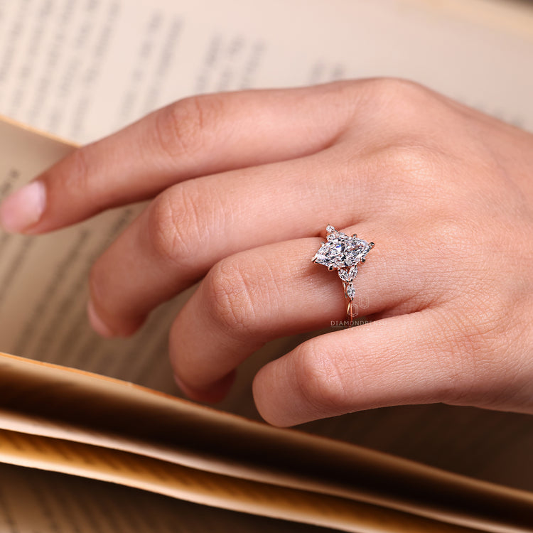 Marquise cut diamond ring with six claw prong setting.