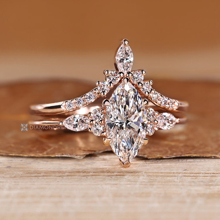 Handmade marquise ring with marquise and round diamonds.