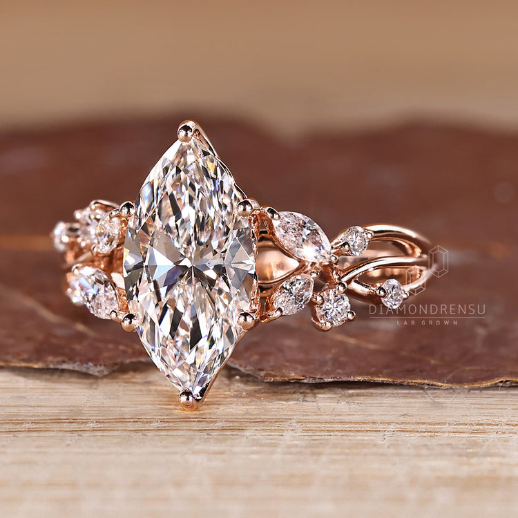Marquise diamond ring with round side stone accents