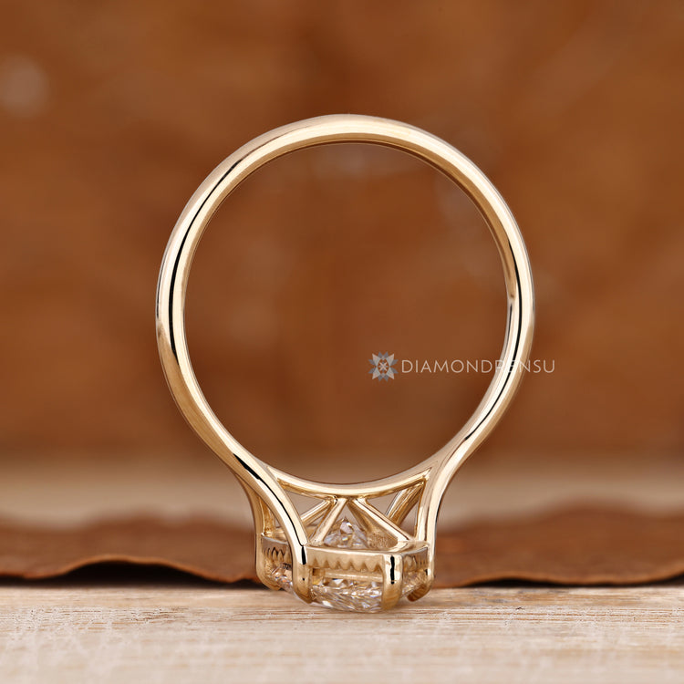 Marquise cut ring with six claw prong setting.