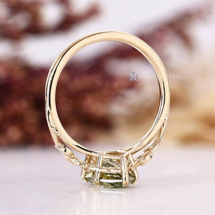 Handmade green diamond ring with nature inspired style.