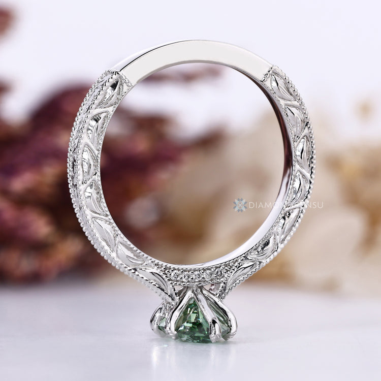 Dutch marquise cut ring with engraved shank and milgrain details.