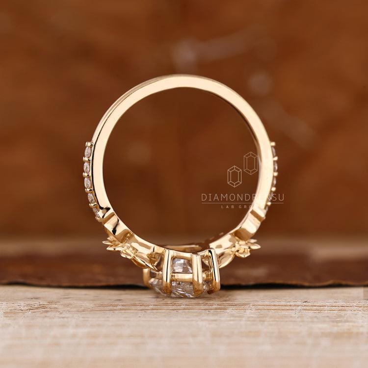 Handmade marquise ring with floral and side stones.