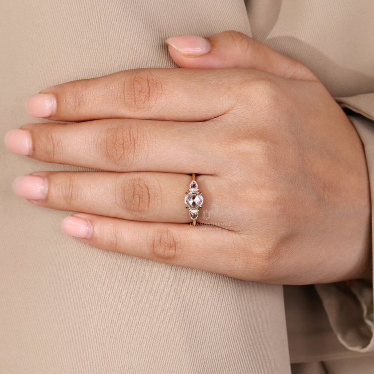 Tapered shank diamond ring with rose cut center stone.