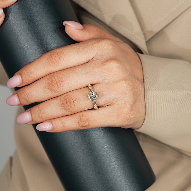 Handmade oval engagement ring with four claw prong setting.