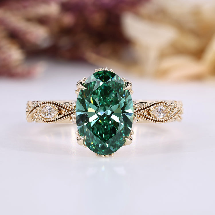 Oval cut diamond ring with green centre diamond.