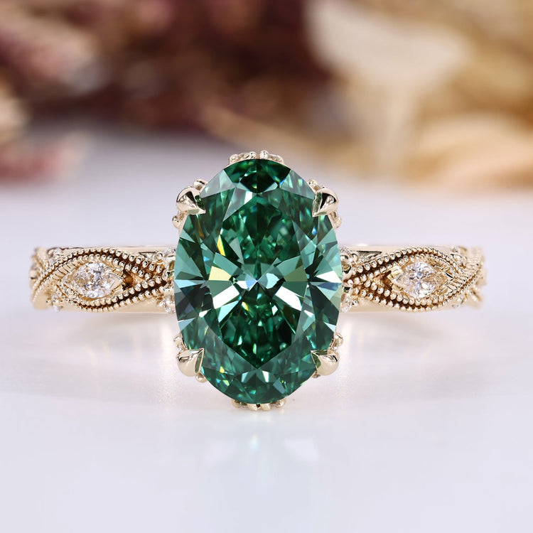Oval cut diamond ring with green centre diamond.