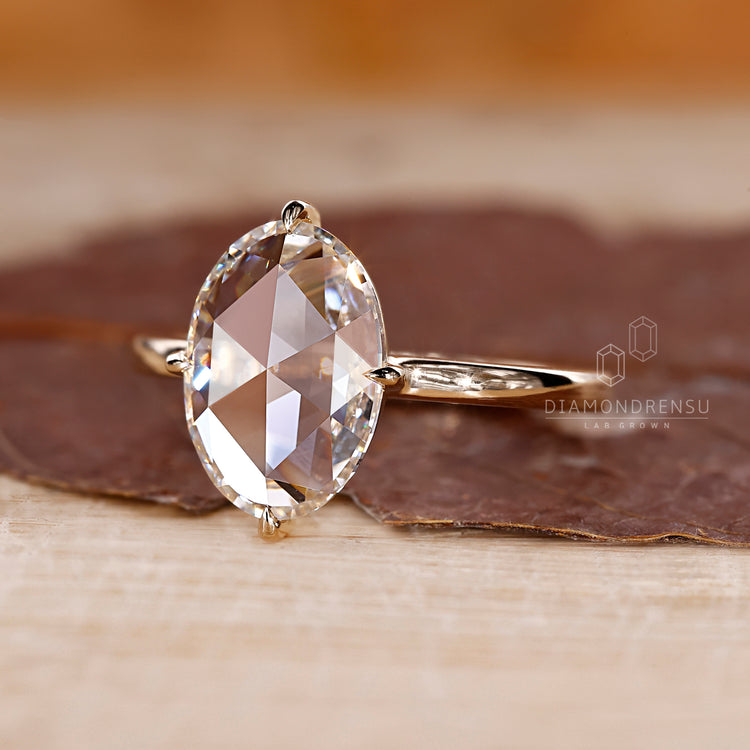 Oval rose cut diamond ring with open gallery style.