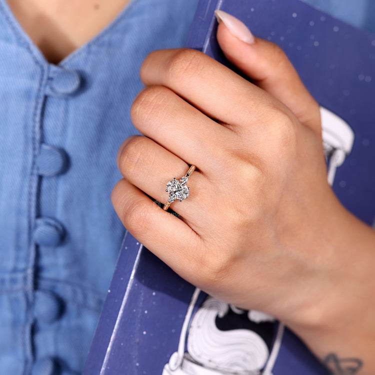 IGI certified oval diamond ring with round side stones.