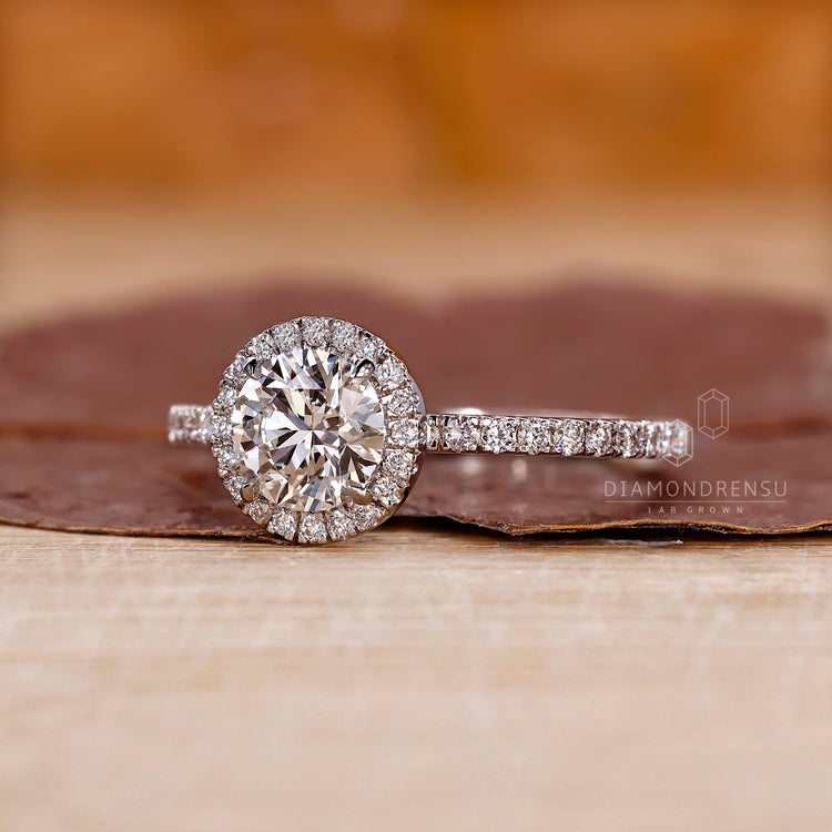 Round cut pave setting ring with hidden accents.