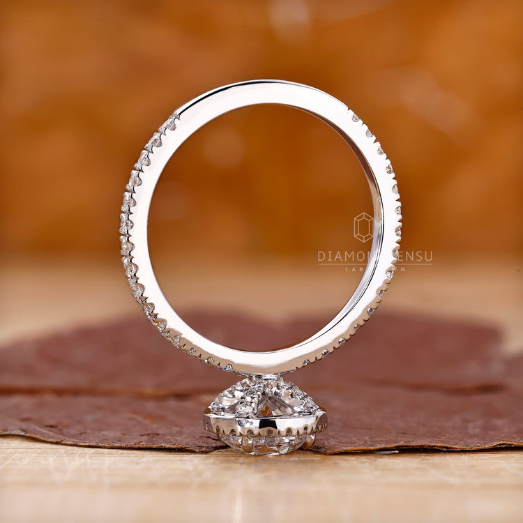 Buy diamond ring with round cut and pave details.
