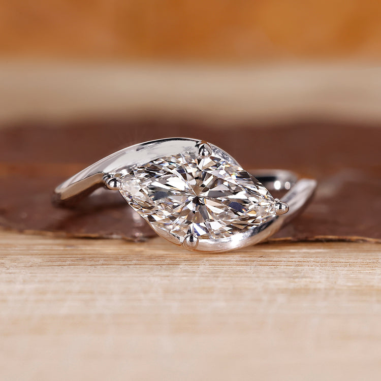 East to west setting ring with marquise diamond.