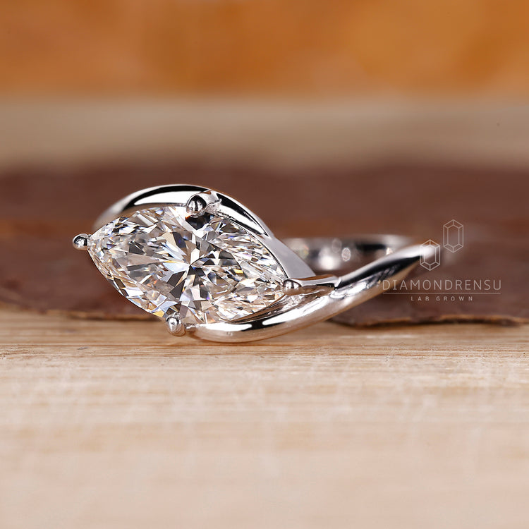 Buy diamond ring with marquise shaped center stone.