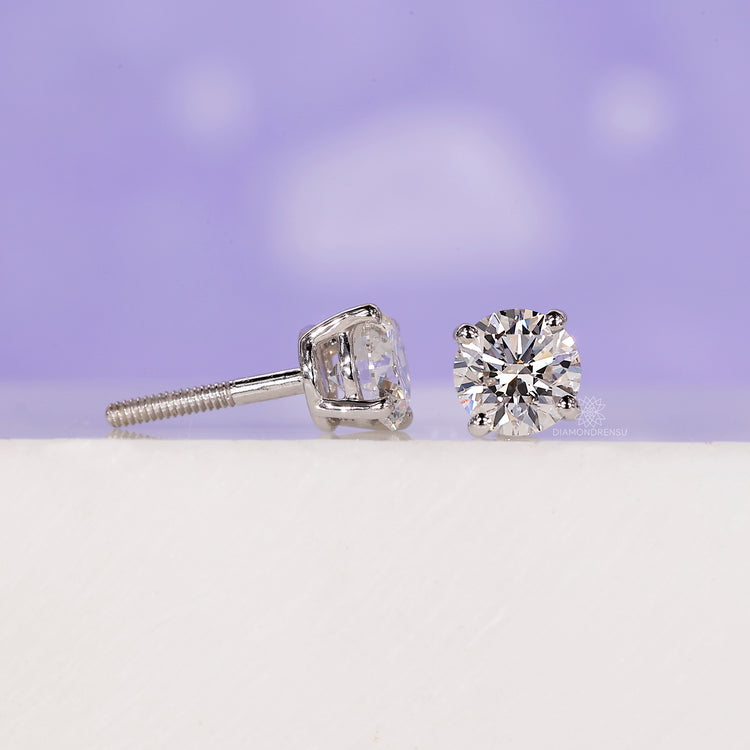 Four round prong setting earrings.