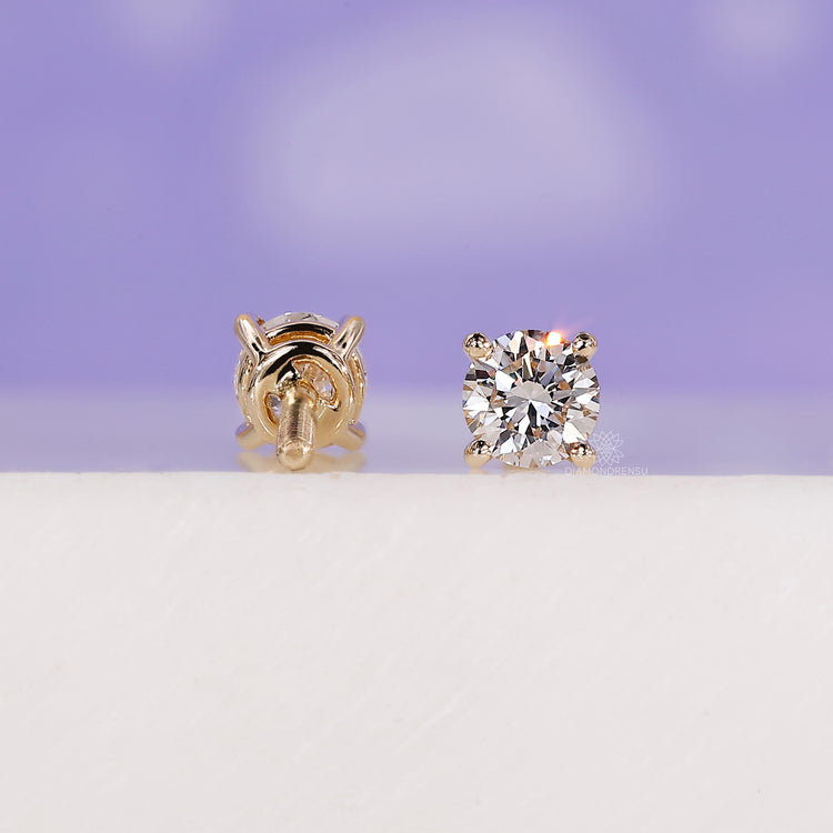 Small lab diamond earrings in gold.