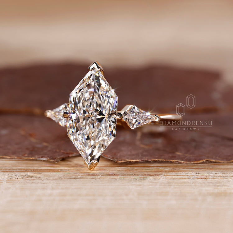 Tapered shank ring with Dutch Marquise centerpiece.