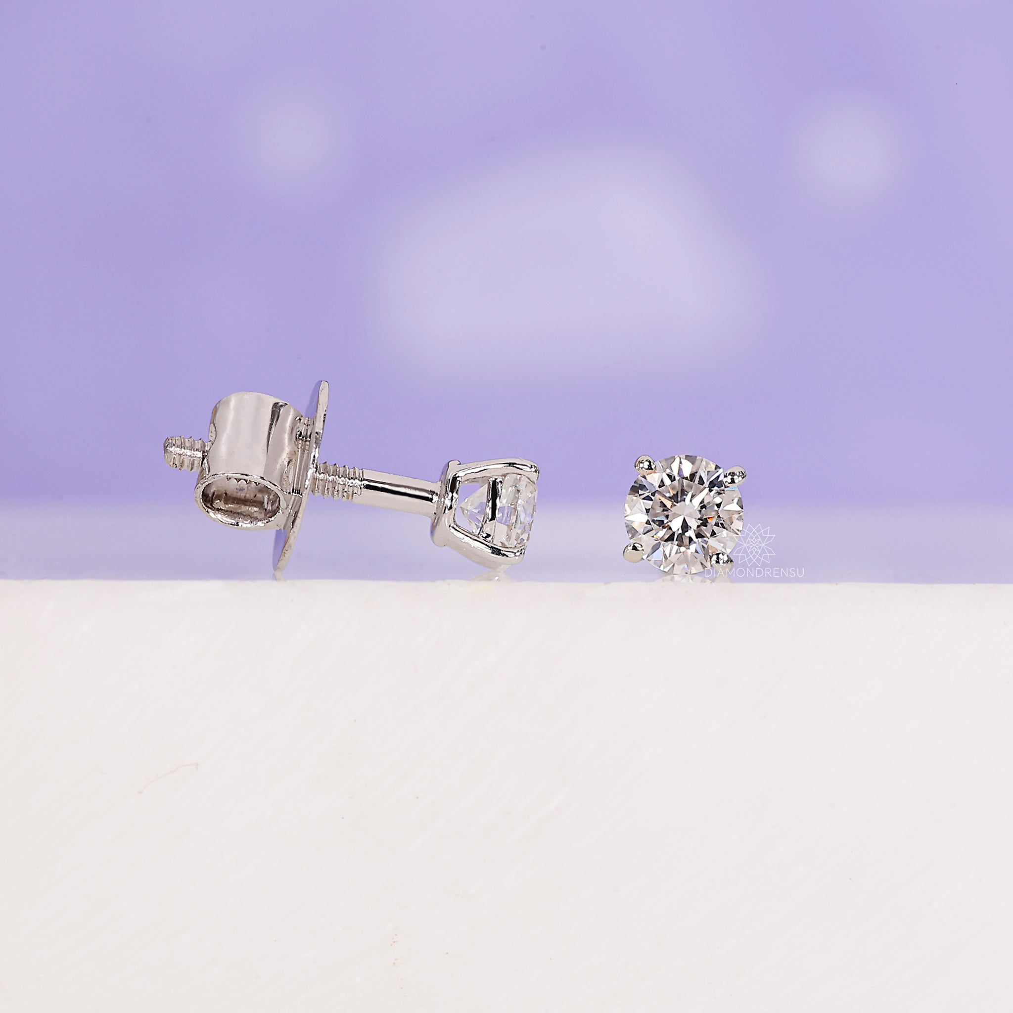 Minimalist diamond stud earrings for daily wear.