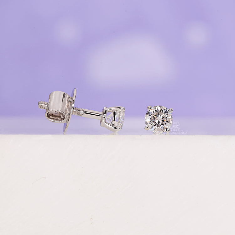 Minimalist diamond stud earrings for daily wear.