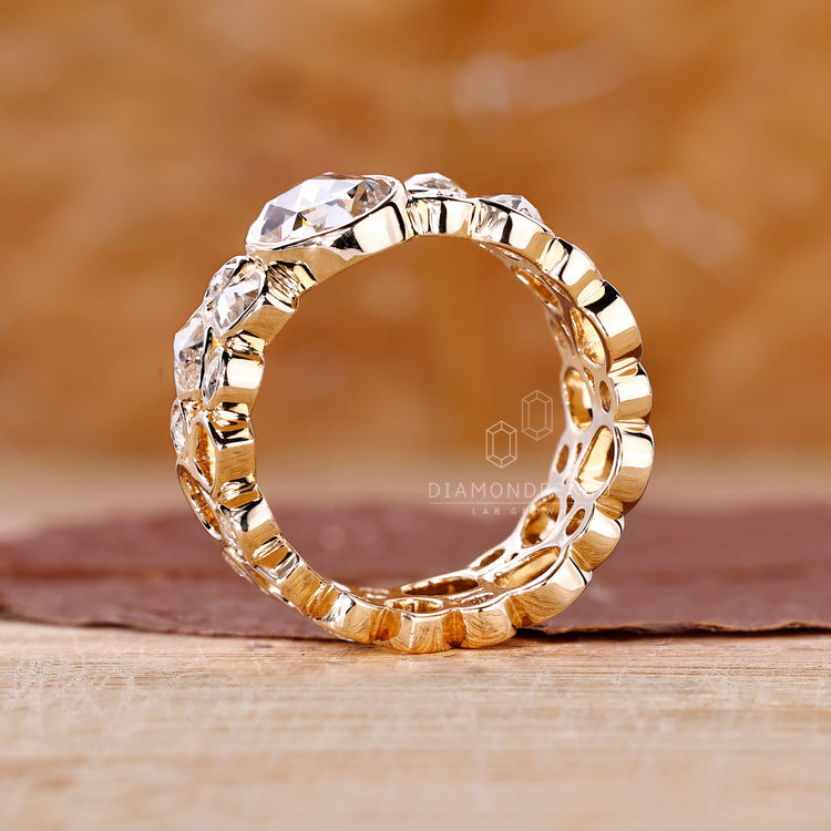 Pear Rose Cut Side Diamond placed alongside center oval diamond.