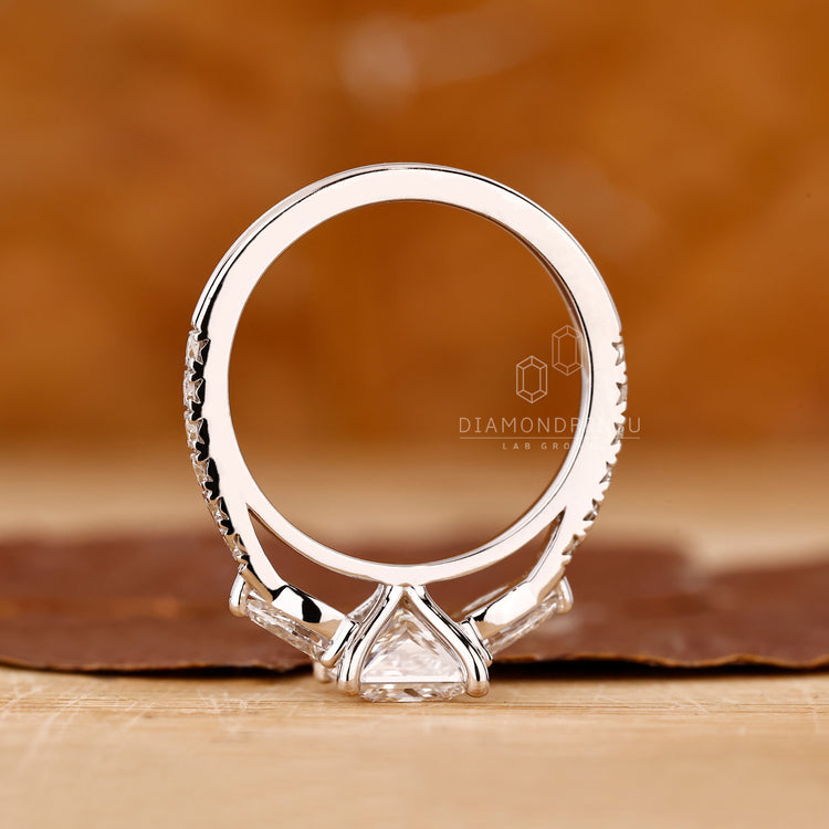 UK engagement ring with princess and pear cut diamonds