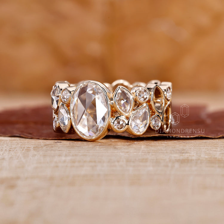 Oval Rose Cut Center Stone is main focus of the ring.