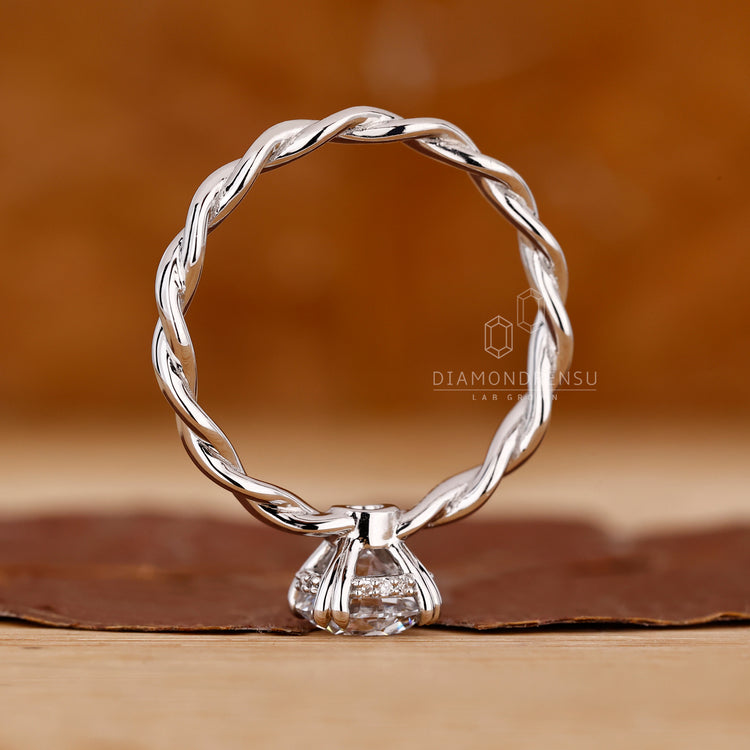 Buy engagement ring with double claw and twisted setting.