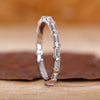 Baguette diamond wedding band crafted in white gold with full eternity style.