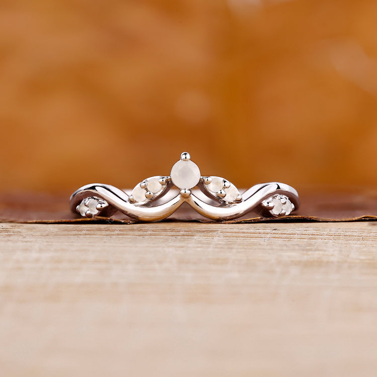 Tiara wedding band with moonstone and diamond accents.