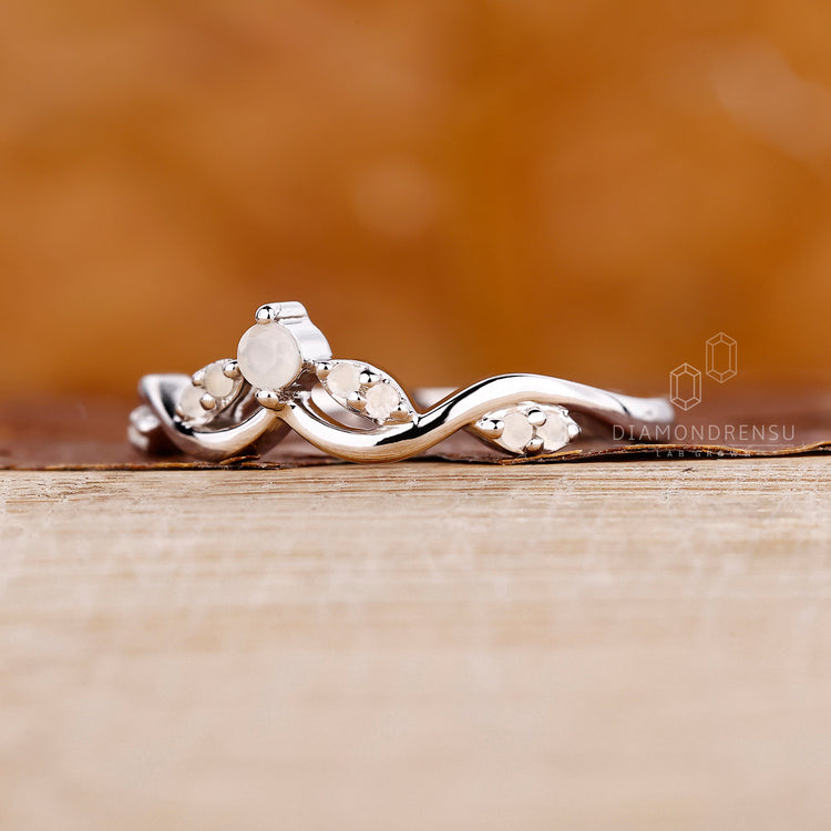 Moonstone diamond ring set in white gold.