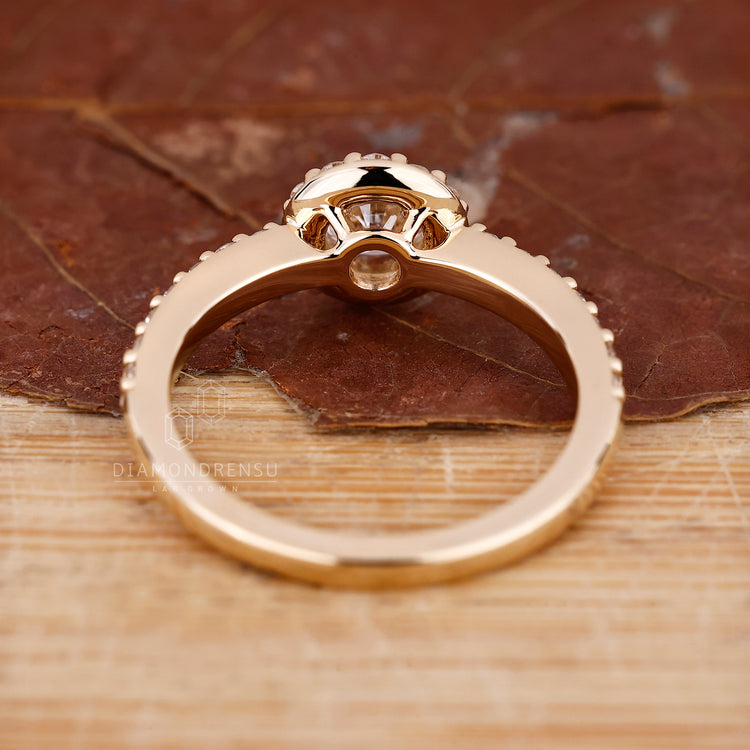 Lab grown diamond ring with 4 round prong setting.