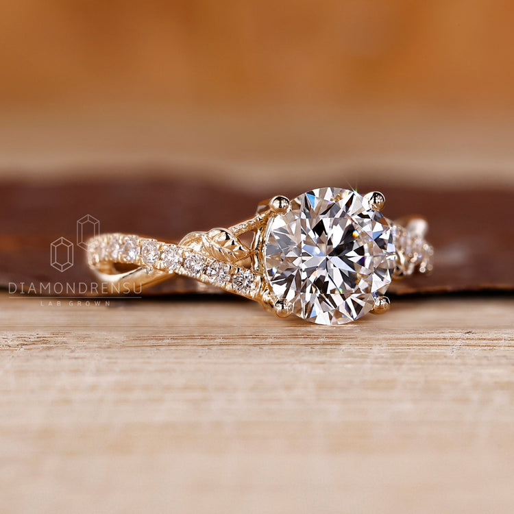 Yellow gold engagement ring featuring twisted design.