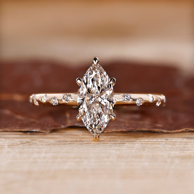 Marquise engagement ring with six claw prong setting.