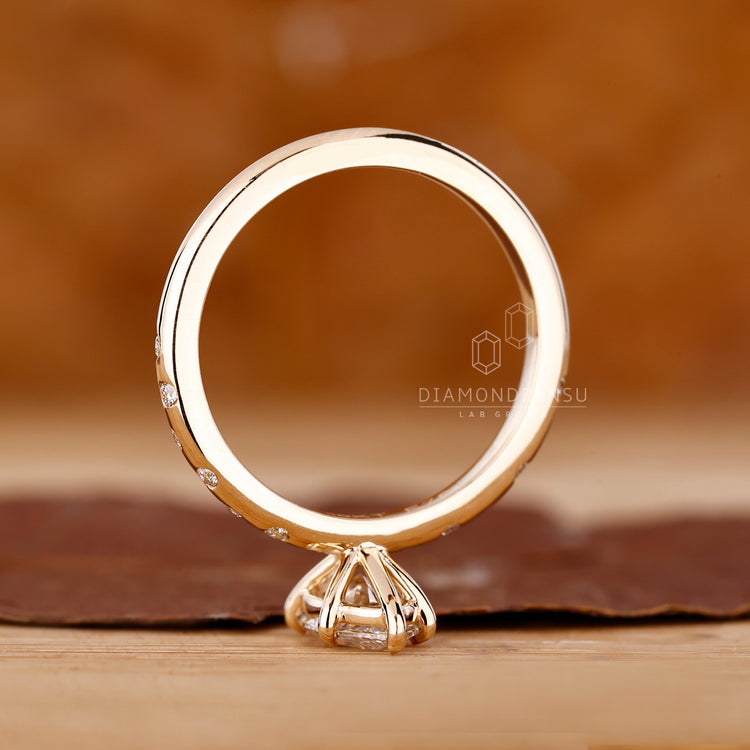 Lab grown diamond engagement ring in marquise shape.